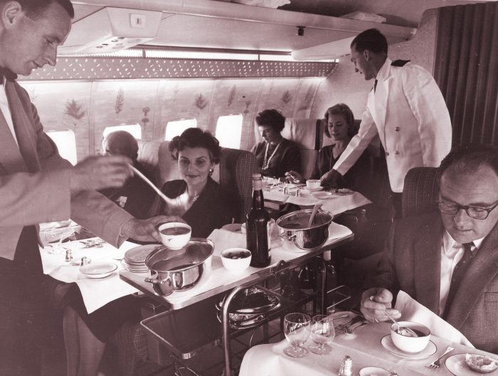 Circa 1959: First Class meal service onboard a Qantas Boeing 707.