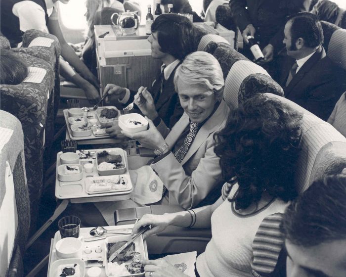 1970s: Passengers enjoy the meal service in Tourist Class.